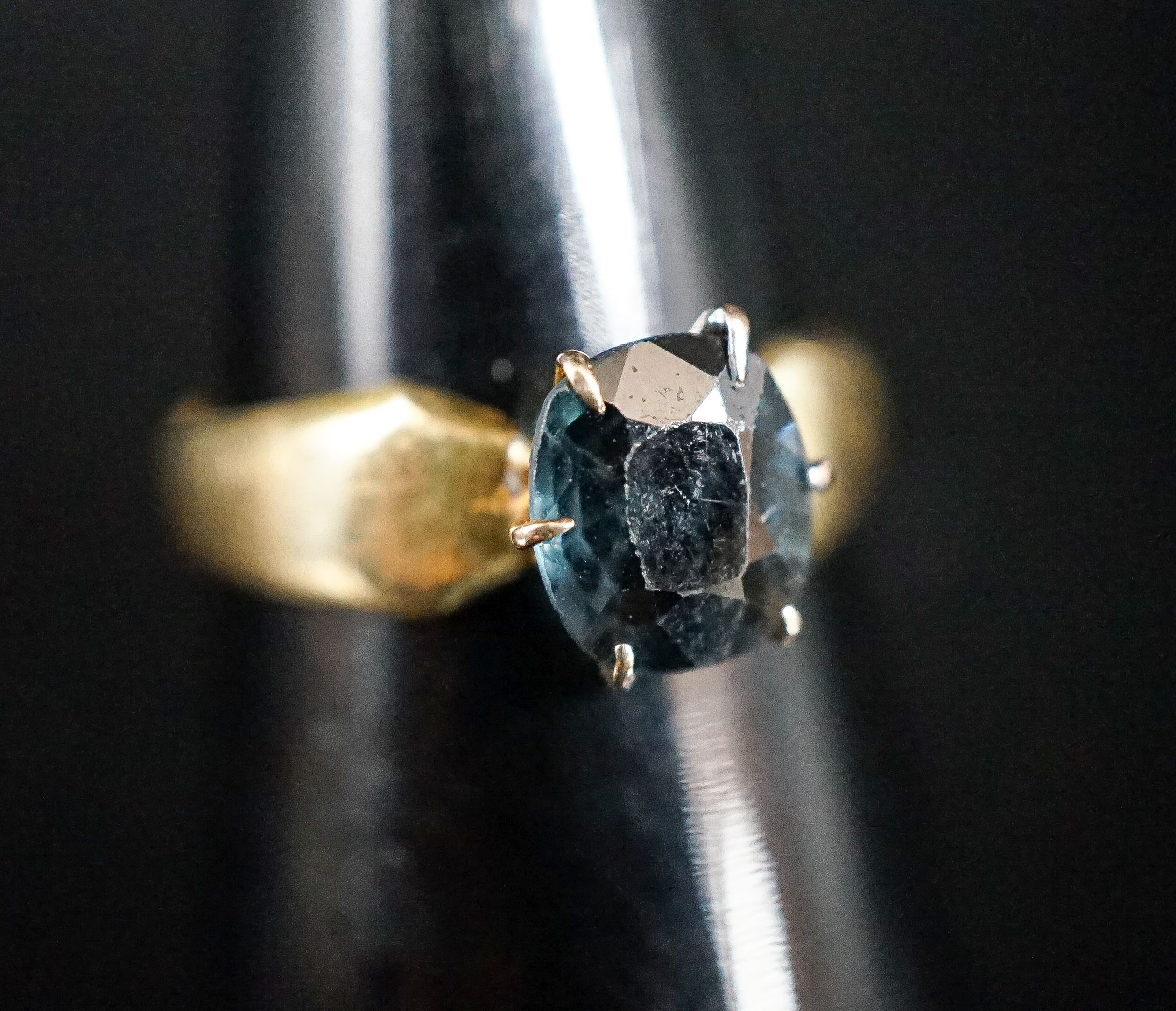 A late Victorian 18ct gold shank, now with later blue stone mounted ring head, gross 3.6 grams.